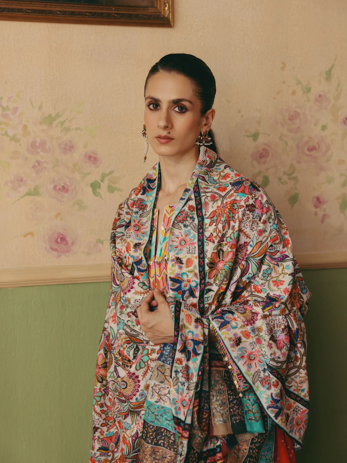 Woman wearing a colourful floral Kalamkari shawl